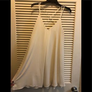 White mini dress. Crossed back